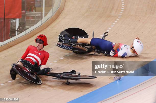 Frederik Madsen of Team Denmark and Charlie Tanfield of Team Great Britain on the ground after fall during the Men´s team pursuit first round, heat 4...
