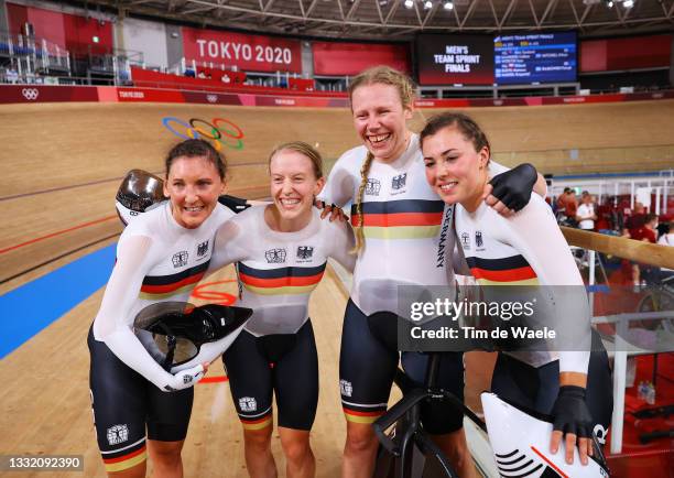 Lisa Brennauer, Franziska Brausse, Mieke Kroeger and Lisa Klein of Team Germany pose for a photograph as they celebrate winning a gold medal during...