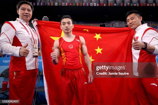 Jingyuan Zou of Team China celebrates winning gold during the Men's Parallel Bars Final on day eleven of the Tokyo 2020 Olympic Games at Ariake...
