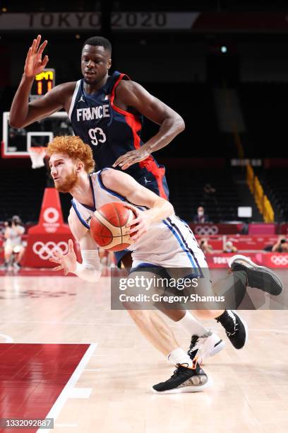 Niccolo Mannion of Team Italy drives to the basket against Moustapha Fall of Team France during the first half of a Men's Basketball Quarterfinal...