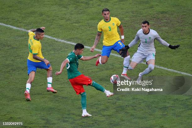 Uriel Antuna of Team Mexico shoots whilst under pressure from Santos of Team Brazil during the Men's Football Semi-final match between Mexico and...