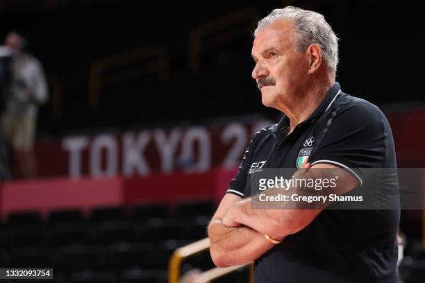 Team Italy Head Coach Meo Sacchetti watches his team play Team France during the first half of a Men's Basketball Quarterfinal game on day eleven of...