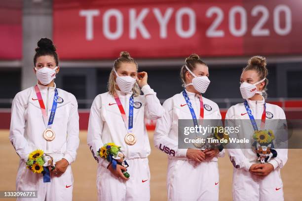 Bronze medalists Chloe Dygert, Megan Jastrab, Jennifer Valente, Emma White of Team United States, pose on the podium during the medal ceremony during...