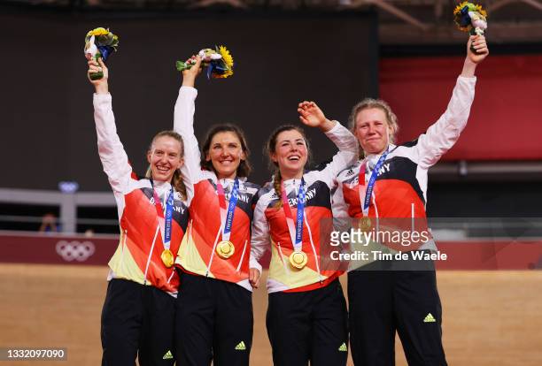 Gold medalist Franziska Brausse, Lisa Brennauer, Lisa Klein and Mieke Kroeger of Team Germany, pose on the podium during the medal ceremony during...