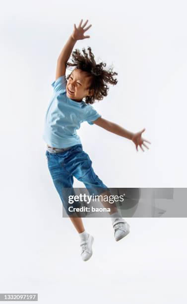 little boy jumping on white background - children jumping stock pictures, royalty-free photos & images