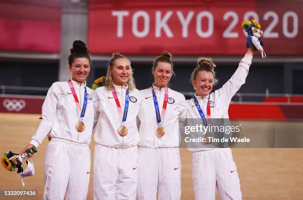 Bronze medalists Chloe Dygert, Megan Jastrab, Jennifer Valente, Emma White of Team United States, pose on the podium during the medal ceremony during...