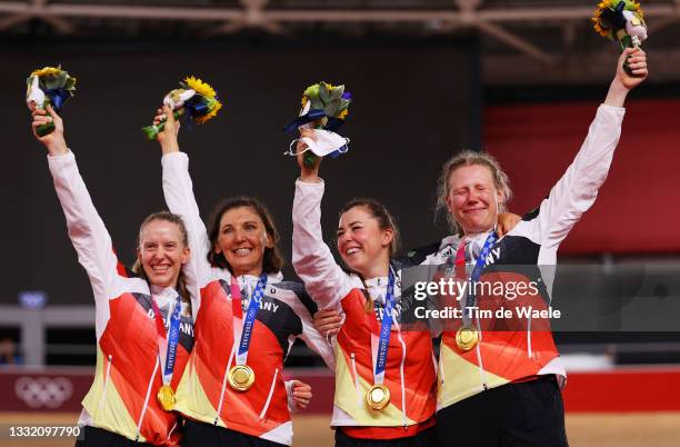 Gold medalist Franziska Brausse, Lisa Brennauer, Lisa Klein and Mieke Kroeger of Team Germany, pose on the podium during the medal ceremony after the...