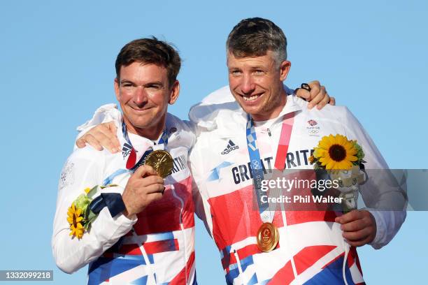 Dylan Fletcher and Stuart Bithell of Team Great Britain pose with their gold medals for the Men's Skiff 49er class on day eleven of the Tokyo 2020...