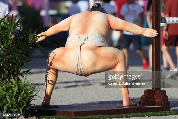 General view of a Sumo wrestler jump is seen during the Jumping Individual Qualifier on day eleven of the Tokyo 2020 Olympic Games at Equestrian Park...