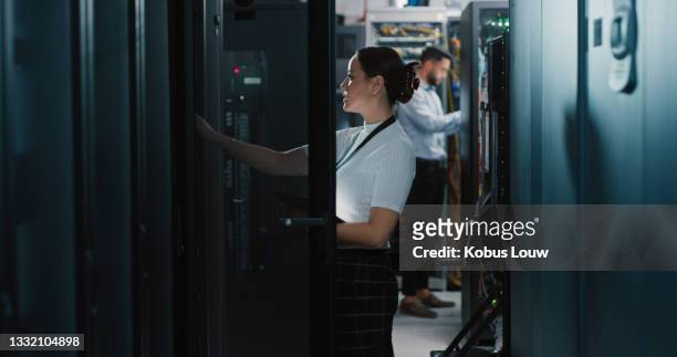 shot of two colleagues working together in a server room - data centre stock pictures, royalty-free photos & images
