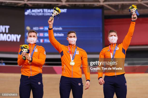 Gold medalists Jeffrey Hoogland, Harrie Lavreysen and Roy van den Berg of Team Netherlands, pose on the podium during the medal ceremony after the...