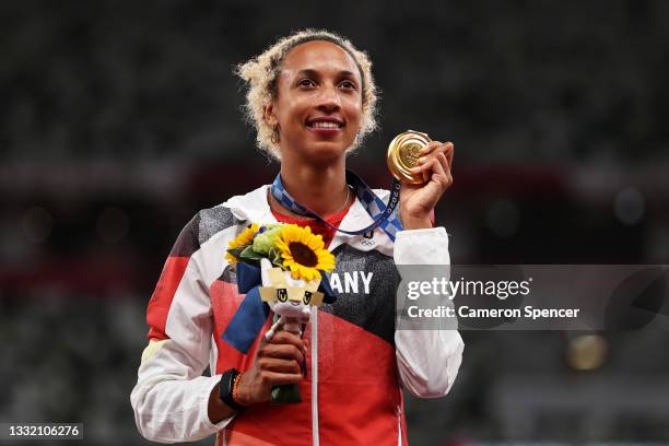 Gold medalist Malaika Mihambo of Team Germany holds up her medal on the podium during the medal ceremony for the Women’s Long Jump on day eleven of...