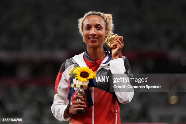 Gold medalist Malaika Mihambo of Team Germany holds up her medal on the podium during the medal ceremony for the Women’s Long Jump on day eleven of...