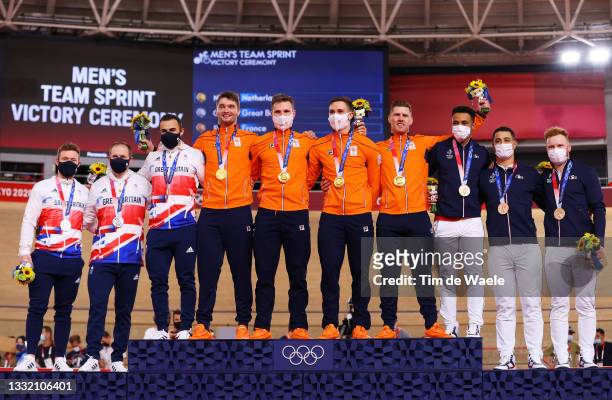 Silver medalist Jack Carlin, Jason Kenny and Ryan Owens of Team Great Britain, gold medalists Matthijs Buchli, Jeffrey Hoogland, Harrie Lavreysen and...