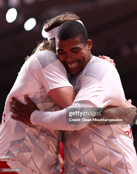 Mikkel Hansen embraces Mads Mensah of Team Denmark after winning the Men's Quarterfinal handball match between Denmark and Norway on day eleven of...