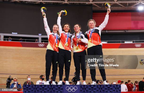 Gold medalists Franziska Brausse, Lisa Brennauer, Lisa Klein and Mieke Kroeger of Team Germany, pose on the podium during the medal ceremony after...