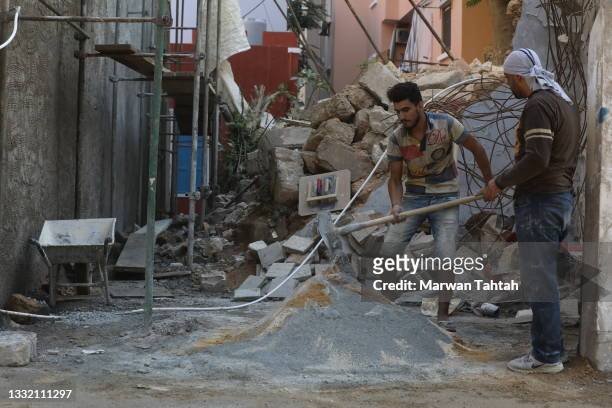 Ongoing construction work and daily life in the Karantina neighbourhood closest to the port and badly damaged during the blast on August 03, 2021 in...