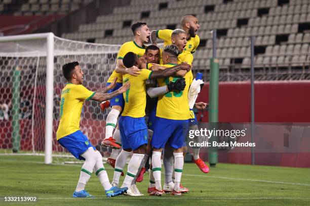 Reinier of Team Brazil celebrates with team mates after scoring their side's winning penalty during the penalty shoot out during the Men's Football...