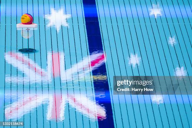 The ball and Australian flag are reflected on the surface of the pool during the Women's Quarterfinal match between Australia and Team ROC on day...