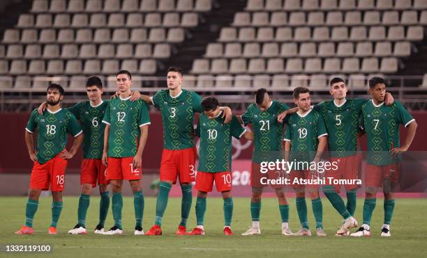 Players of Team Mexico look dejected during the penalty shoot out during the Men's Football Semi-final match between Mexico and Brazil on day eleven...