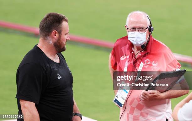 Tomas Walsh of Team New Zealand speaks with judge Trevor Spittle d the Men's Shot Put qualification on day eleven of the Tokyo 2020 Olympic Games at...