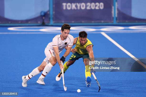 Lukas Windfeder of Team Germany and Tim Brand of Team Australia battle for the ball during the Men's Semifinal match between Australia and Germany on...