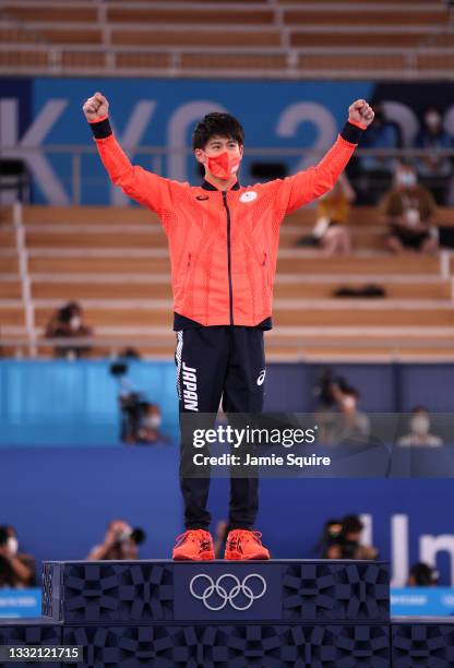 Daiki Hashimoto of Team Japan celebrates on the podium during the Men's Horizontal Bar Final medal ceremony on day eleven of the Tokyo 2020 Olympic...