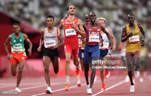 Mohamed Katir of Team Spain and Paul Chelimo of Team United States celebrate qualification in the Men's 5000m heats on day eleven of the Tokyo 2020...