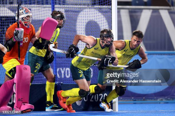 Jeremy Thomas Hayward of Team Australia runs to defend a penalty corner with defensive teammates during the Men's Semifinal match between Australia...