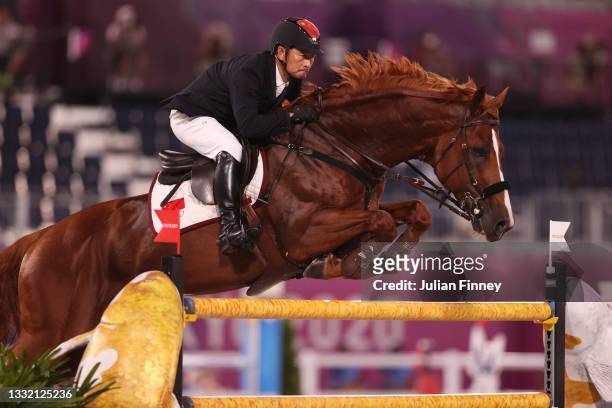 Zhenqiang of Team China riding Uncas S competes during the Jumping Individual Qualifier on day eleven of the Tokyo 2020 Olympic Games at Equestrian...