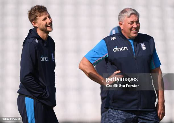 England captain Joe Root and coach Chris Silverwood share a joke during England nets ahead of the First Test match against India at Trent Bridge on...