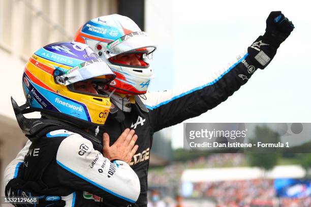 Esteban Ocon of France and Alpine celebrates victory in parc ferme with team-mate Fernando Alonso of Spain and Alpine after the F1 Grand Prix of...