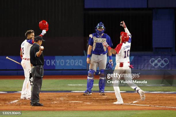 Jeison Guzman of Team Dominican Republic celebrates with Gustavo Nunez after hitting a solo home run in the seventh inning against Team Israel during...