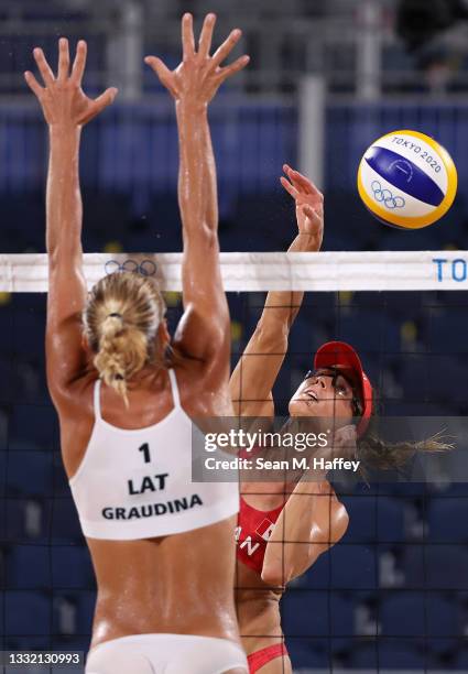 Tina Graudina of Team Latvia competes against Heather Bansley of Team Canada during the Women's Quarterfinal beach volleyball on day eleven of the...