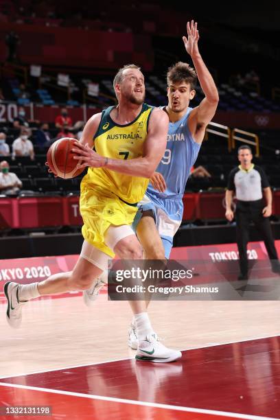 Joe Ingles of Team Australia drives to the basket against Nicolas Brussino of Team Argentina during the first half of a Men's Basketball Quarterfinal...