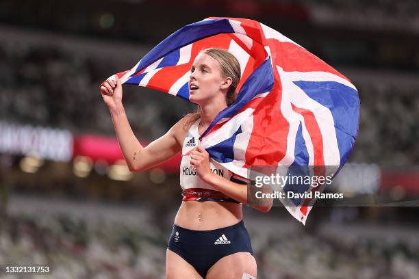 Keely Hodgkinson of Team Great Britain celebrates with her countries flag after winning the silver medal in the Women's 800m Final on day eleven of...