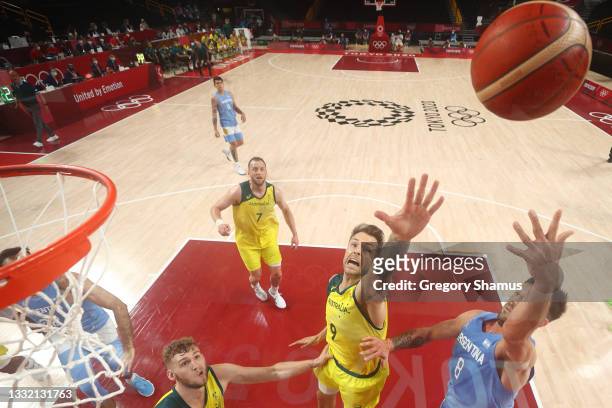 Nicolas Laprovittola of Team Argentina drives to the basket against Nathan Sobey of Team Australia during the first half of a Men's Basketball...