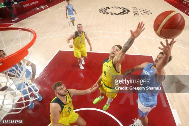 Nicolas Laprovittola of Team Argentina drives to the basket against Nathan Sobey and Jock Landale of Team Australia during the first half of a Men's...