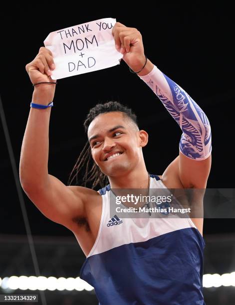 Emmanouil Karalis of Team Greece holds up a sign for his Mom and Dad during the Men's Pole Vault Final on day eleven of the Tokyo 2020 Olympic Games...
