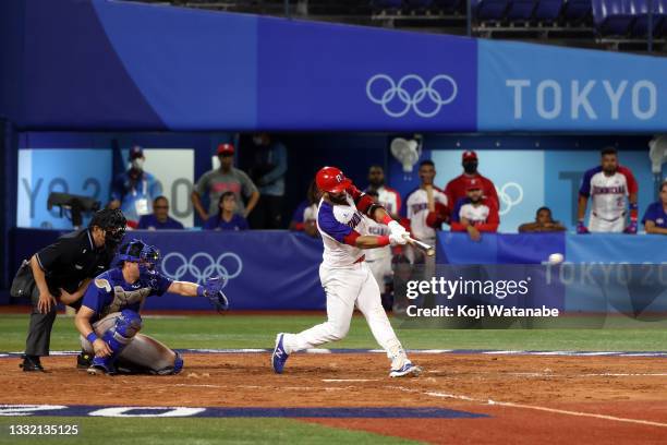Jose Bautista of Team Dominican Republic hits a game-winning RBI single in the ninth inning to defeat Team Israel 7-6 during the knockout stage of...