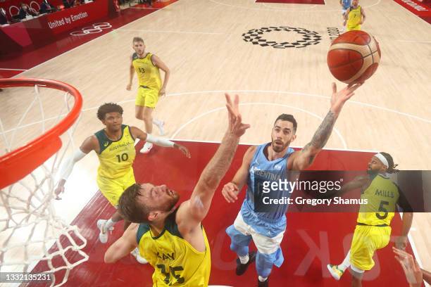 Luca Vildoza of Team Argentina drives to the basket against Nic Kay of Team Australia as Matisse Thybulle looks on during the first half of a Men's...