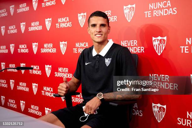 Erik Lamela attends to the media during his presentation as a new Sevilla FC player at Estadio Ramon Sanchez Pizjuan on August 03, 2021 in Seville,...
