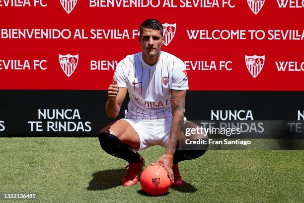 Erik Lamela attends to the media during his presentation as a new Sevilla FC player at Estadio Ramon Sanchez Pizjuan on August 03, 2021 in Seville,...