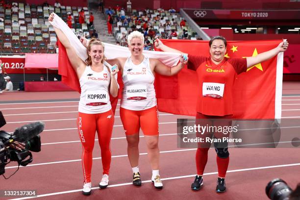 Bronze Medalist Malwina Kopron of Team Poland, gold medalist Anita Wlodarczyk of Team Poland and silver medalist Zheng Wang of Team China pose for a...
