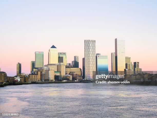 city skyline of london canary wharf at dusk - canary wharf ストックフォトと画像