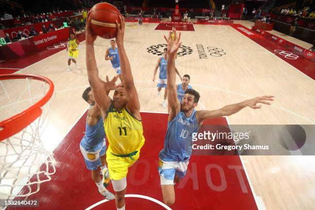 Dante Exum of Team Australia goes up for a dunk against Leandro Nicolas Bolmaro of Team Argentina during the second half of a Men's Basketball...