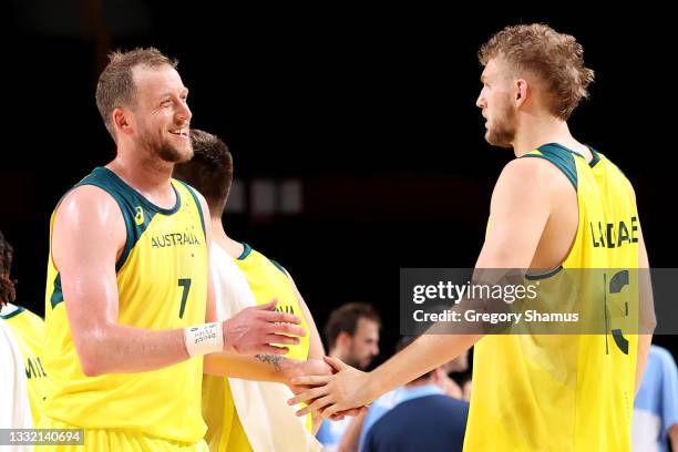 Joe Ingles of Team Australia high-fives teammate Jock Landale during the second half of a Men's Basketball Quarterfinal game against Team Argentina...