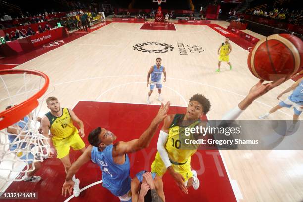 Matisse Thybulle of Team Australia drives to the basket against Luis Scola of Team Argentina during the second half of a Men's Basketball...