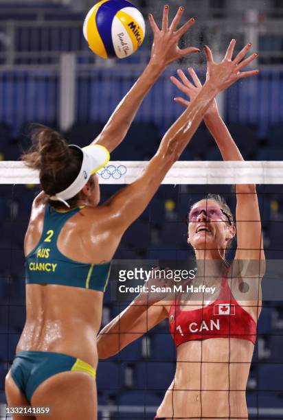 Sarah Pavan of Team Canada competes against Taliqua Clancy of Team Australia during the Women's Quarterfinal beach volleyball on day eleven of the...