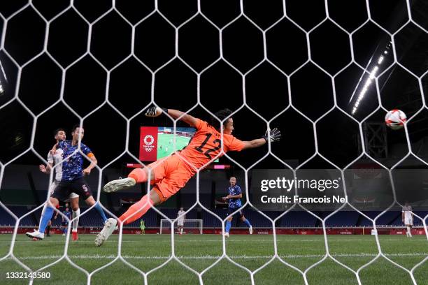 Kosei Tani of Team Japan fails to save the Team Spain first goal scored by Marco Asensio during the Men's Football Semi-final match between Japan and...
